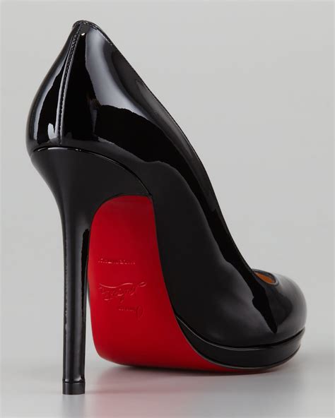 black heels red bottom .